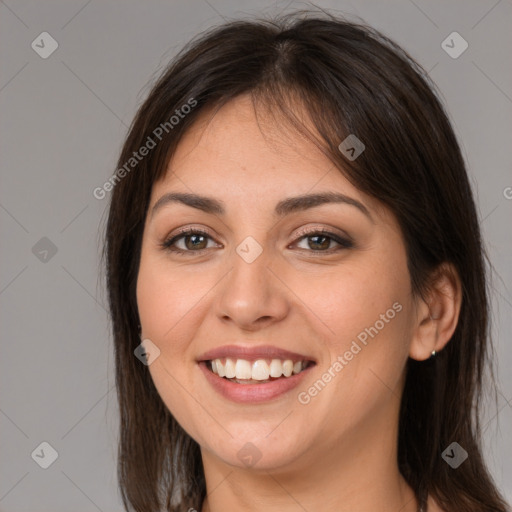 Joyful white young-adult female with medium  brown hair and brown eyes