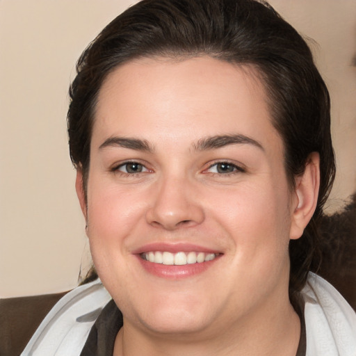 Joyful white young-adult female with medium  brown hair and brown eyes