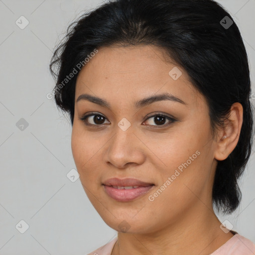 Joyful latino young-adult female with medium  brown hair and brown eyes