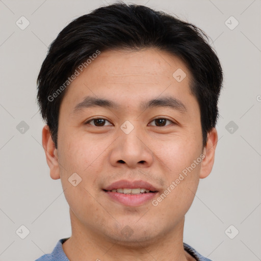 Joyful asian young-adult male with short  brown hair and brown eyes