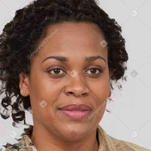 Joyful black adult female with medium  brown hair and brown eyes