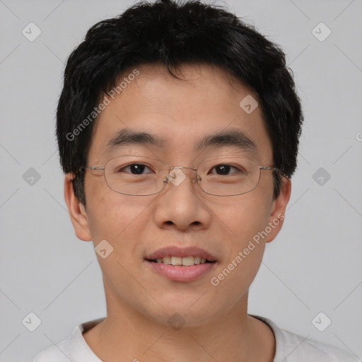 Joyful asian young-adult male with short  brown hair and brown eyes