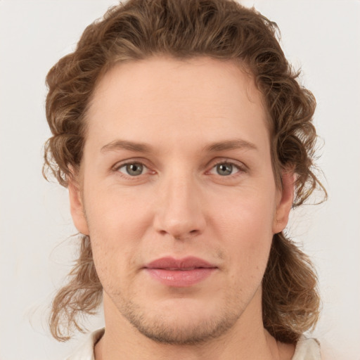 Joyful white young-adult male with medium  brown hair and brown eyes