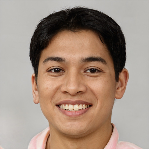 Joyful asian young-adult male with short  brown hair and brown eyes