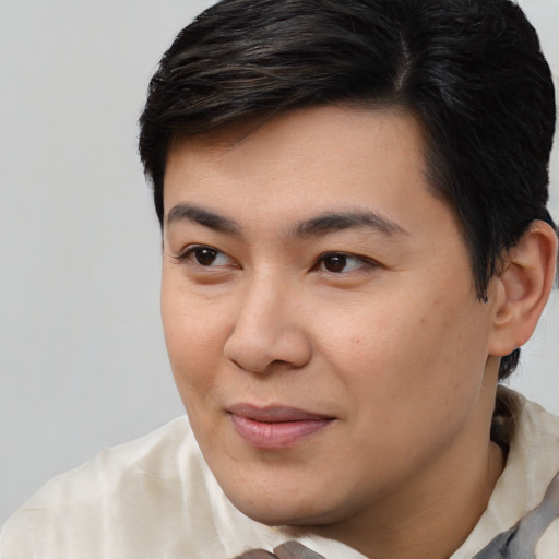 Joyful asian young-adult male with short  brown hair and brown eyes