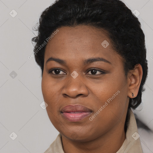 Joyful black young-adult female with short  black hair and brown eyes