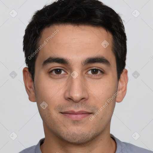 Joyful white young-adult male with short  black hair and brown eyes