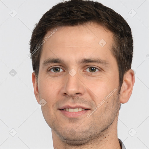 Joyful white young-adult male with short  brown hair and brown eyes