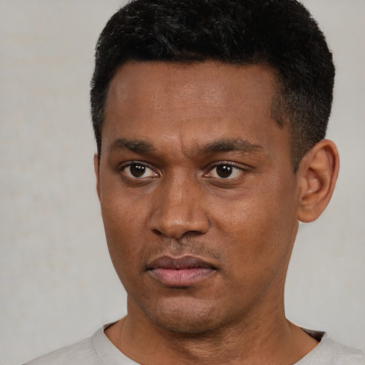 Neutral black young-adult male with short  black hair and brown eyes