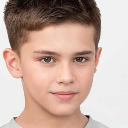 Joyful white child male with short  brown hair and brown eyes