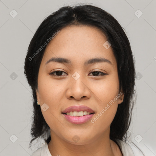 Joyful asian young-adult female with medium  black hair and brown eyes