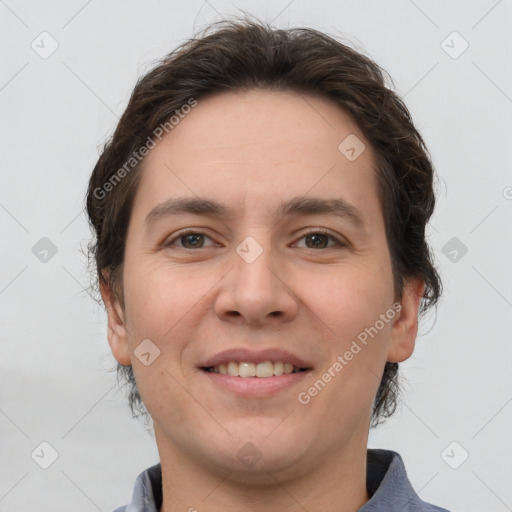 Joyful white young-adult male with medium  brown hair and brown eyes