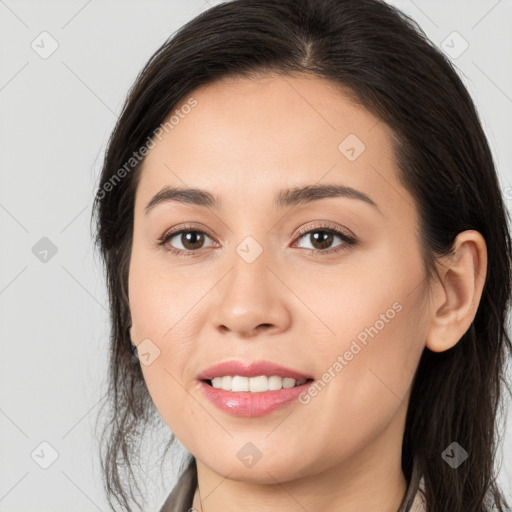 Joyful white young-adult female with long  brown hair and brown eyes