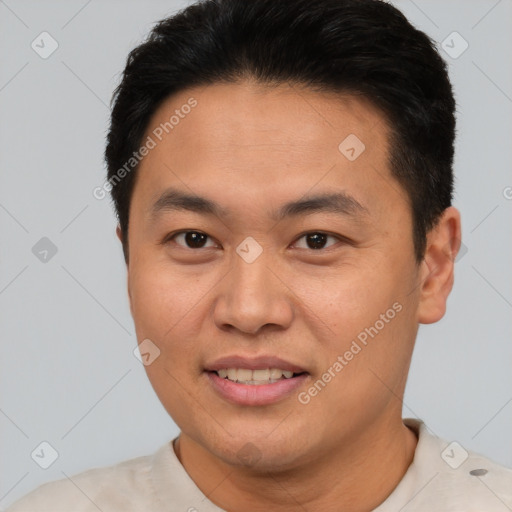 Joyful asian young-adult male with short  brown hair and brown eyes