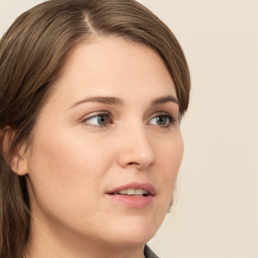 Neutral white young-adult female with long  brown hair and green eyes