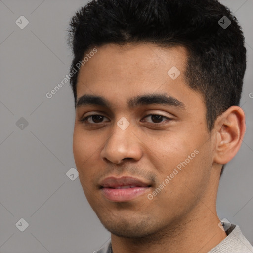 Joyful latino young-adult male with short  black hair and brown eyes