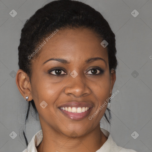 Joyful black young-adult female with short  brown hair and brown eyes