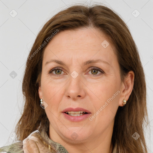 Joyful white adult female with medium  brown hair and green eyes