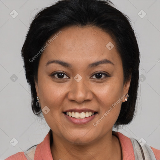 Joyful latino young-adult female with medium  brown hair and brown eyes