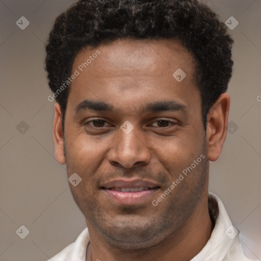 Joyful latino young-adult male with short  brown hair and brown eyes