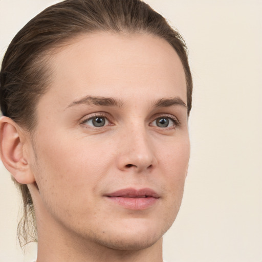 Joyful white young-adult female with short  brown hair and grey eyes