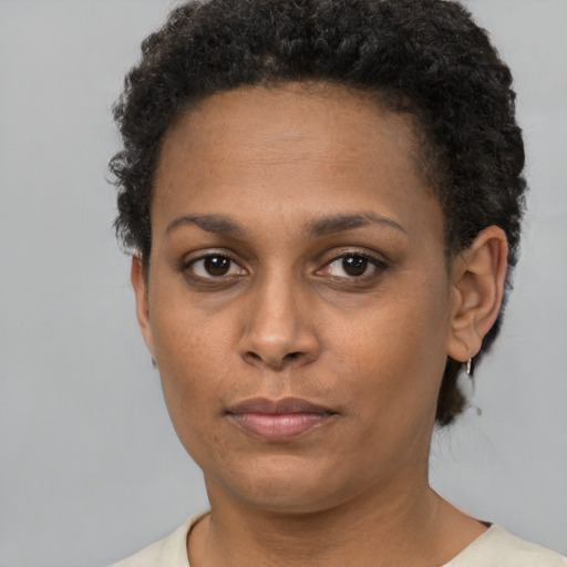 Neutral black young-adult female with short  brown hair and brown eyes