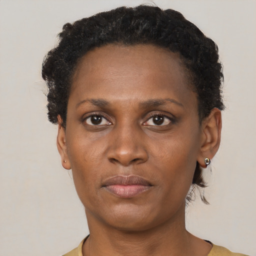 Neutral black adult female with short  brown hair and brown eyes