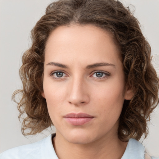 Neutral white young-adult female with medium  brown hair and green eyes