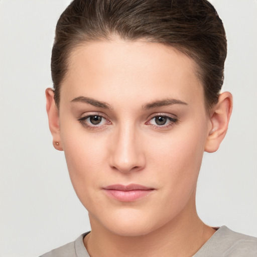 Neutral white young-adult female with short  brown hair and brown eyes