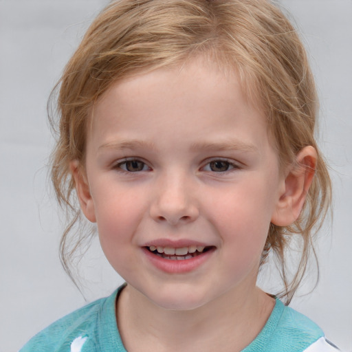 Joyful white child female with medium  brown hair and grey eyes