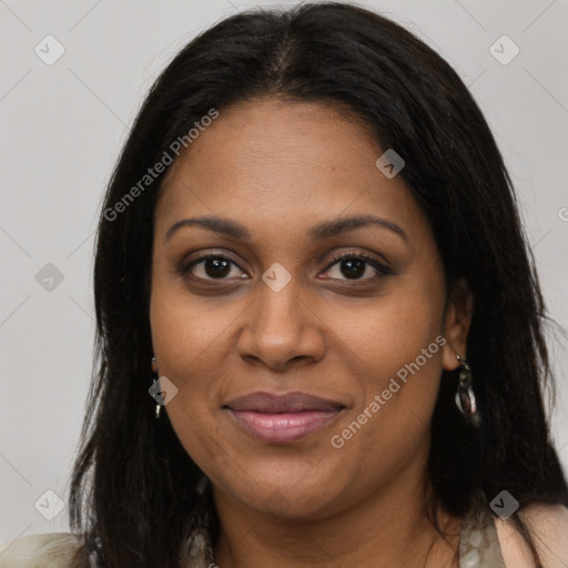 Joyful black young-adult female with long  brown hair and brown eyes