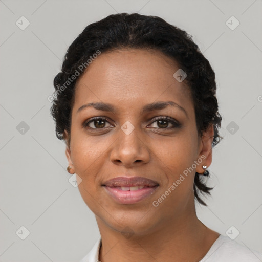 Joyful black young-adult female with short  brown hair and brown eyes