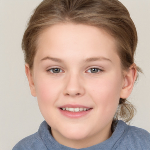 Joyful white child female with medium  brown hair and grey eyes