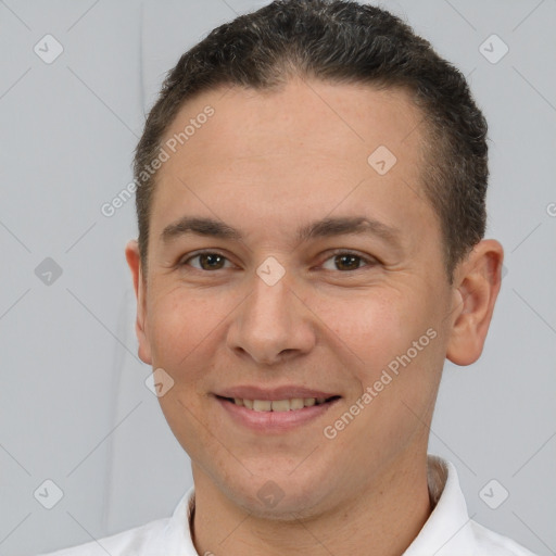 Joyful white adult male with short  brown hair and brown eyes