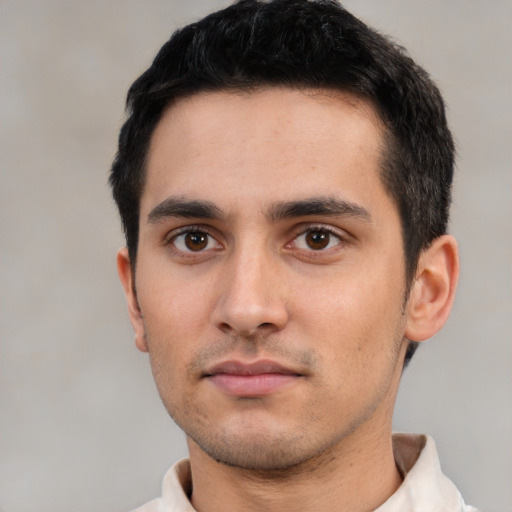 Neutral white young-adult male with short  black hair and brown eyes