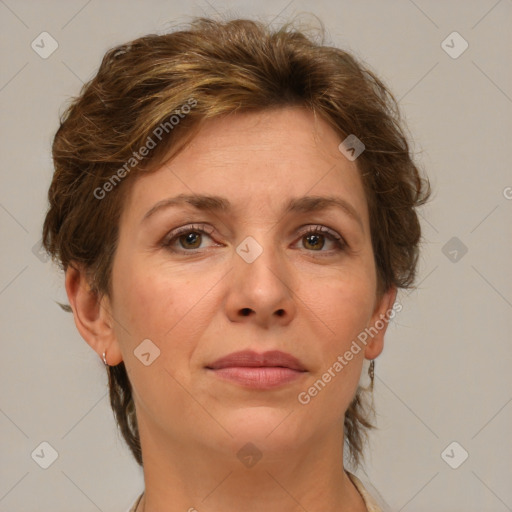 Joyful white adult female with medium  brown hair and green eyes