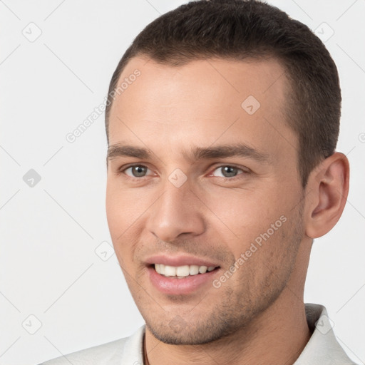 Joyful white young-adult male with short  brown hair and brown eyes