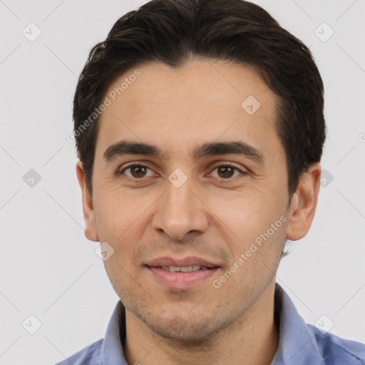 Joyful white adult male with short  black hair and brown eyes