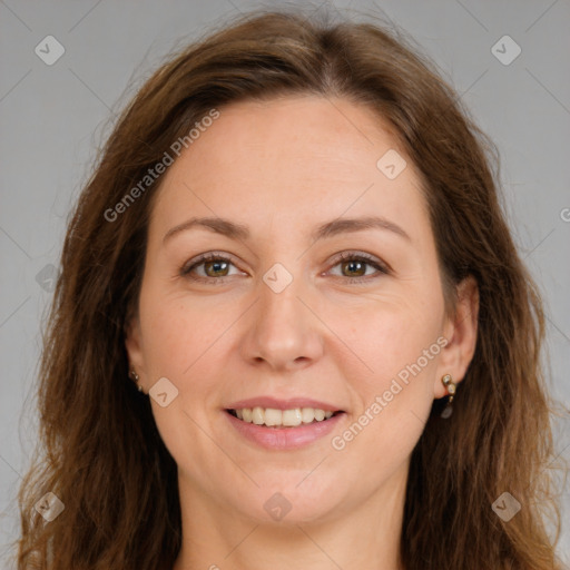 Joyful white adult female with long  brown hair and brown eyes