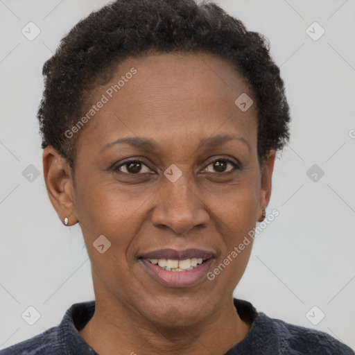 Joyful black adult female with short  brown hair and brown eyes