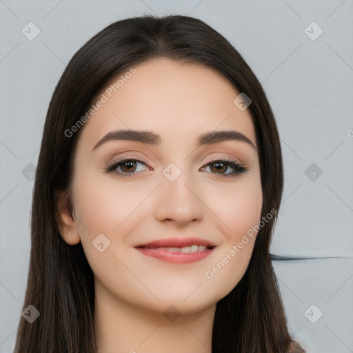 Joyful white young-adult female with long  black hair and brown eyes