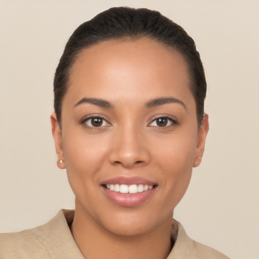 Joyful latino young-adult female with short  black hair and brown eyes