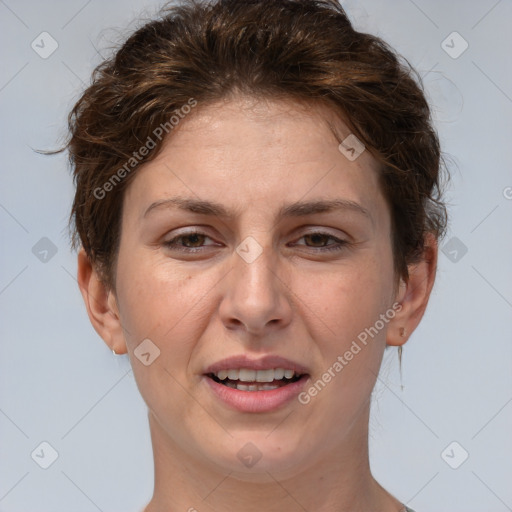 Joyful white adult female with short  brown hair and brown eyes