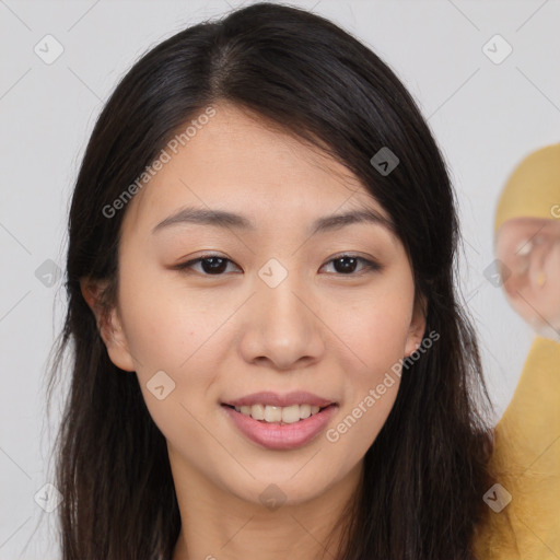 Joyful asian young-adult female with long  brown hair and brown eyes