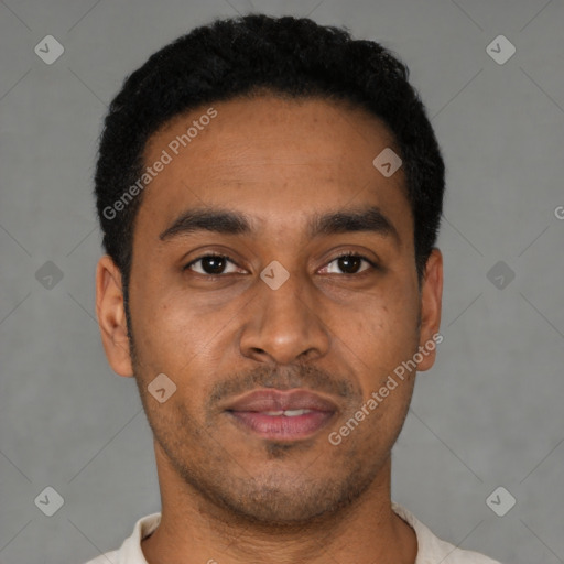 Joyful latino young-adult male with short  black hair and brown eyes