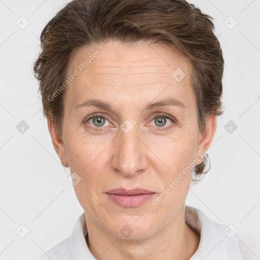 Joyful white adult female with short  brown hair and grey eyes