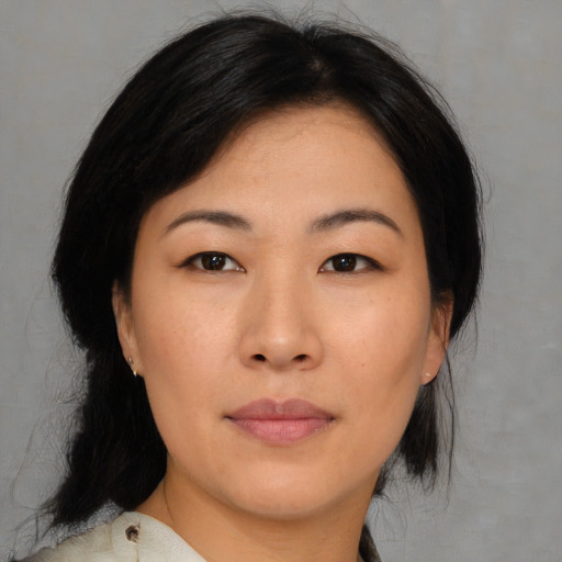 Neutral asian young-adult female with medium  black hair and brown eyes