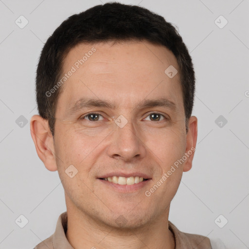 Joyful white adult male with short  brown hair and brown eyes