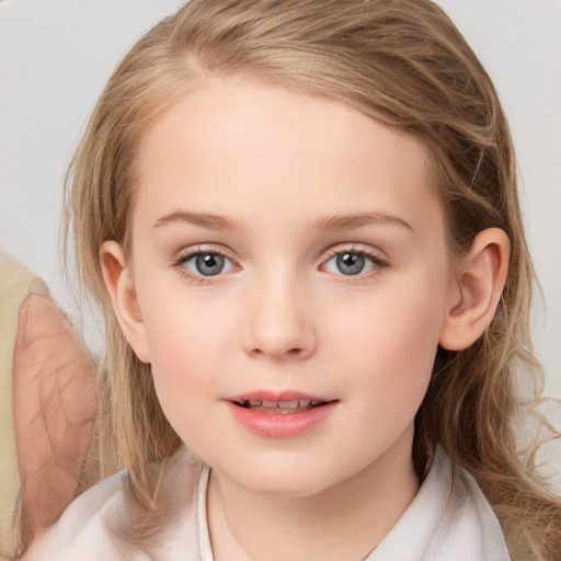 Joyful white child female with medium  brown hair and blue eyes