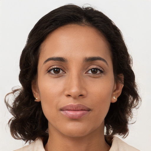 Joyful white young-adult female with medium  brown hair and brown eyes